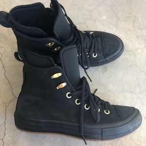 All black suede Converse high tops w gold eyelets
